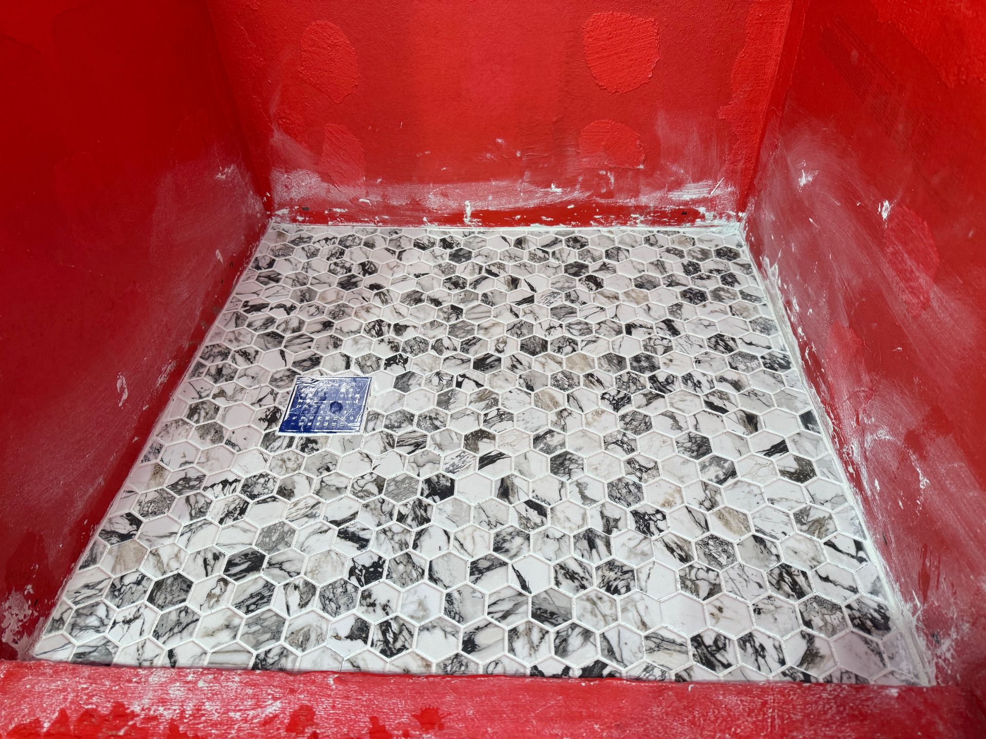 A red box with a tiled floor in it.