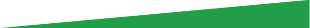 A close up of a green triangle on a white background.