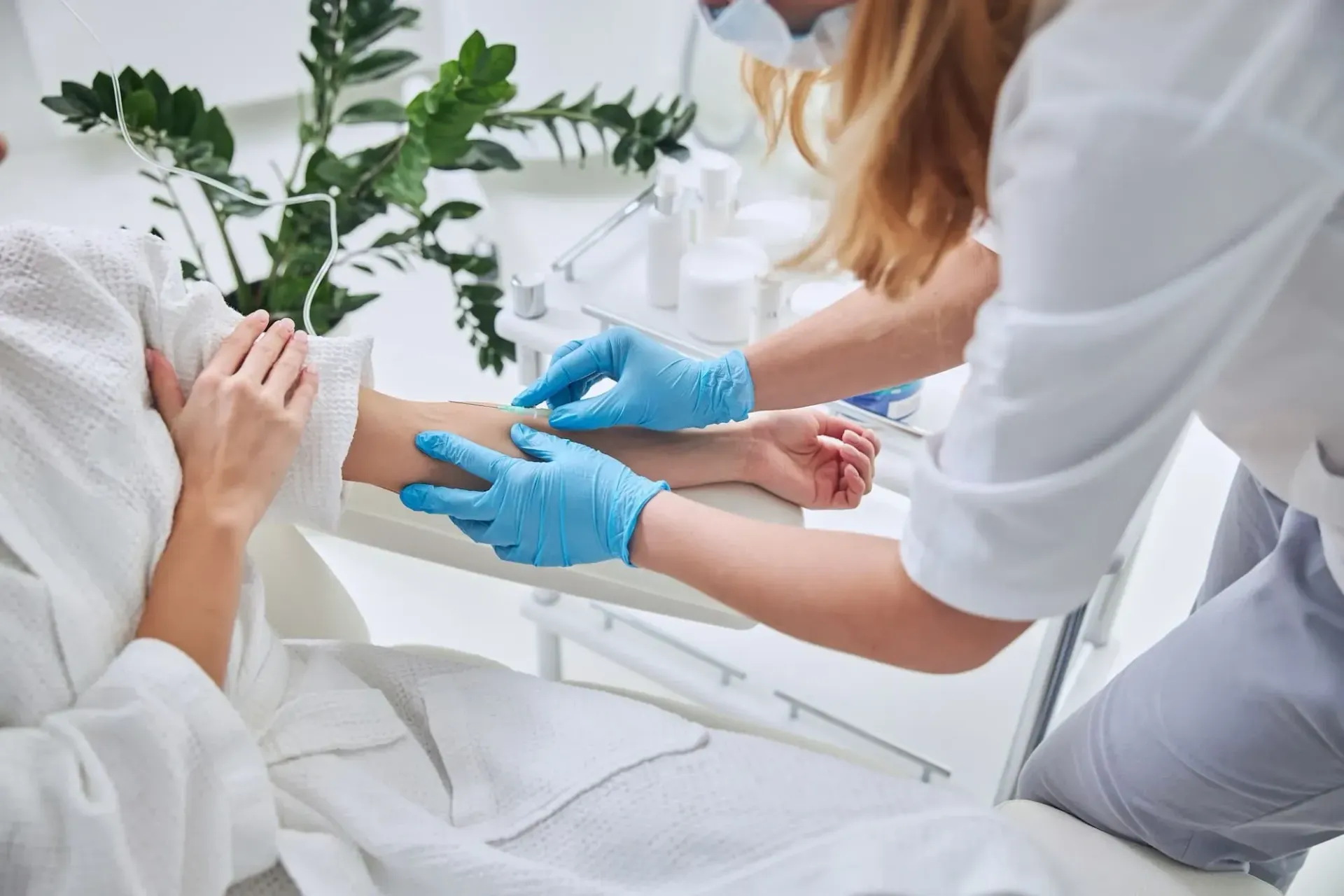 A woman is getting an injection in her arm by a doctor.
