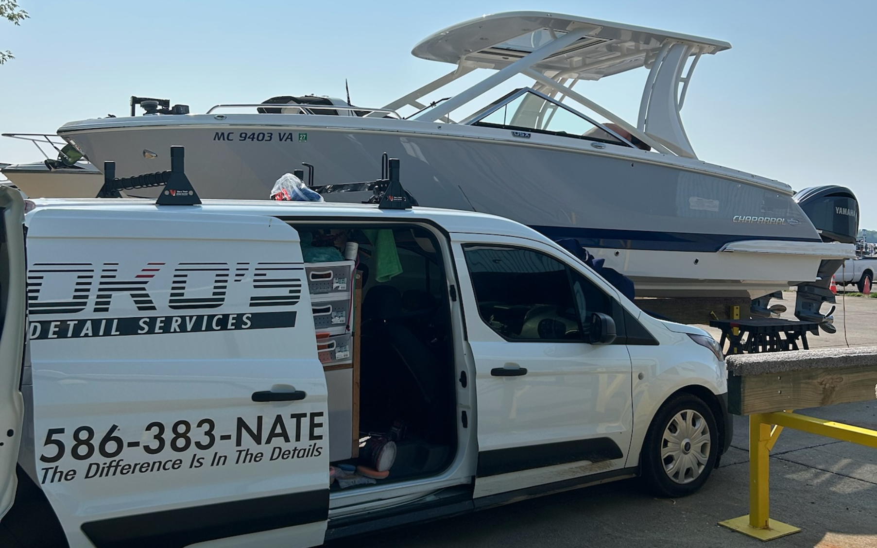A boat is sitting on top of a trailer in a garage.