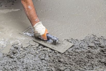 Person Leveling The Concrete