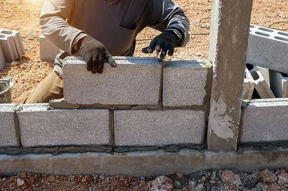 Worker Building Hollow Block Walls