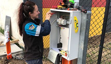 Woman Electrician Fixing The Electrical Panel — John B Electrical In Wooragee VIC