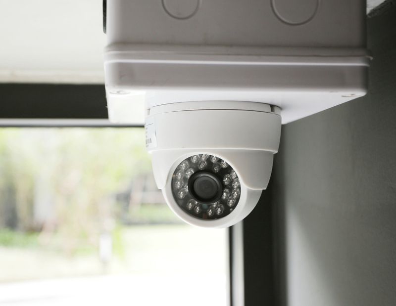 CCTV Security Camera On White Ceiling Operating Inside The Building — John B Electrical In Corowa NSW