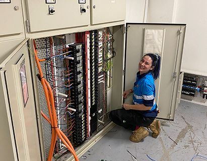 Female Electrician Repairing The Electrical Wiring — John B Electrical In Wooragee VIC