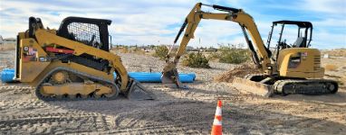 Construction underway using two bobcat auger in Wollongong NSW.