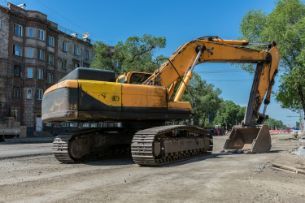 A working track equipment used for digging trenches partnered with an excavator in Wollongong NSW.