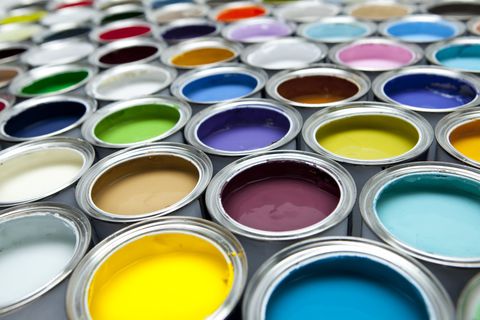 open paint cans in bright colors