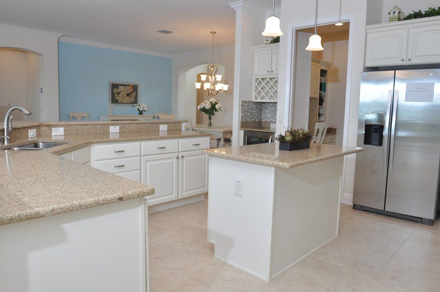 A kitchen with stainless steel appliances and granite counter tops