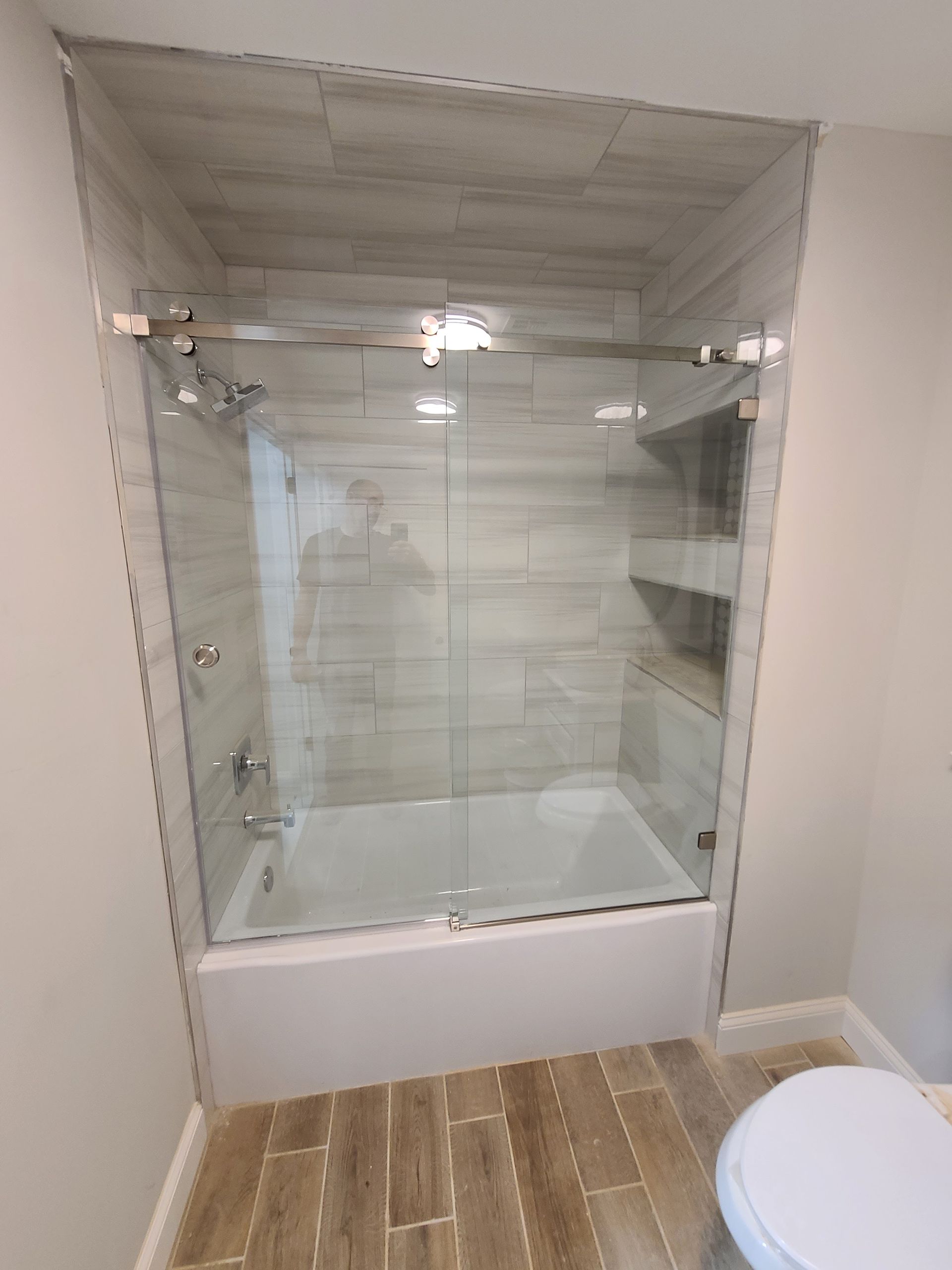 A bathroom with a bathtub and a toilet.