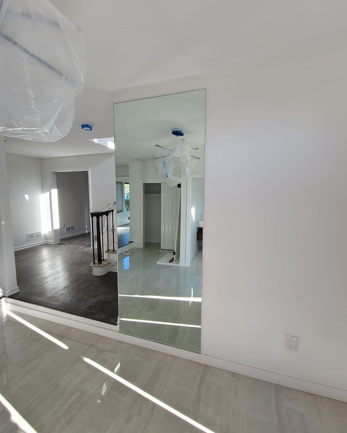 There is a large mirror in the middle of the room.