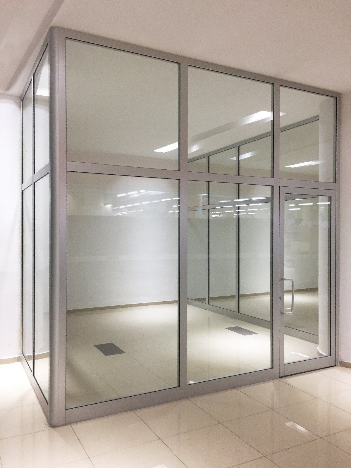 An empty room with a lot of glass doors