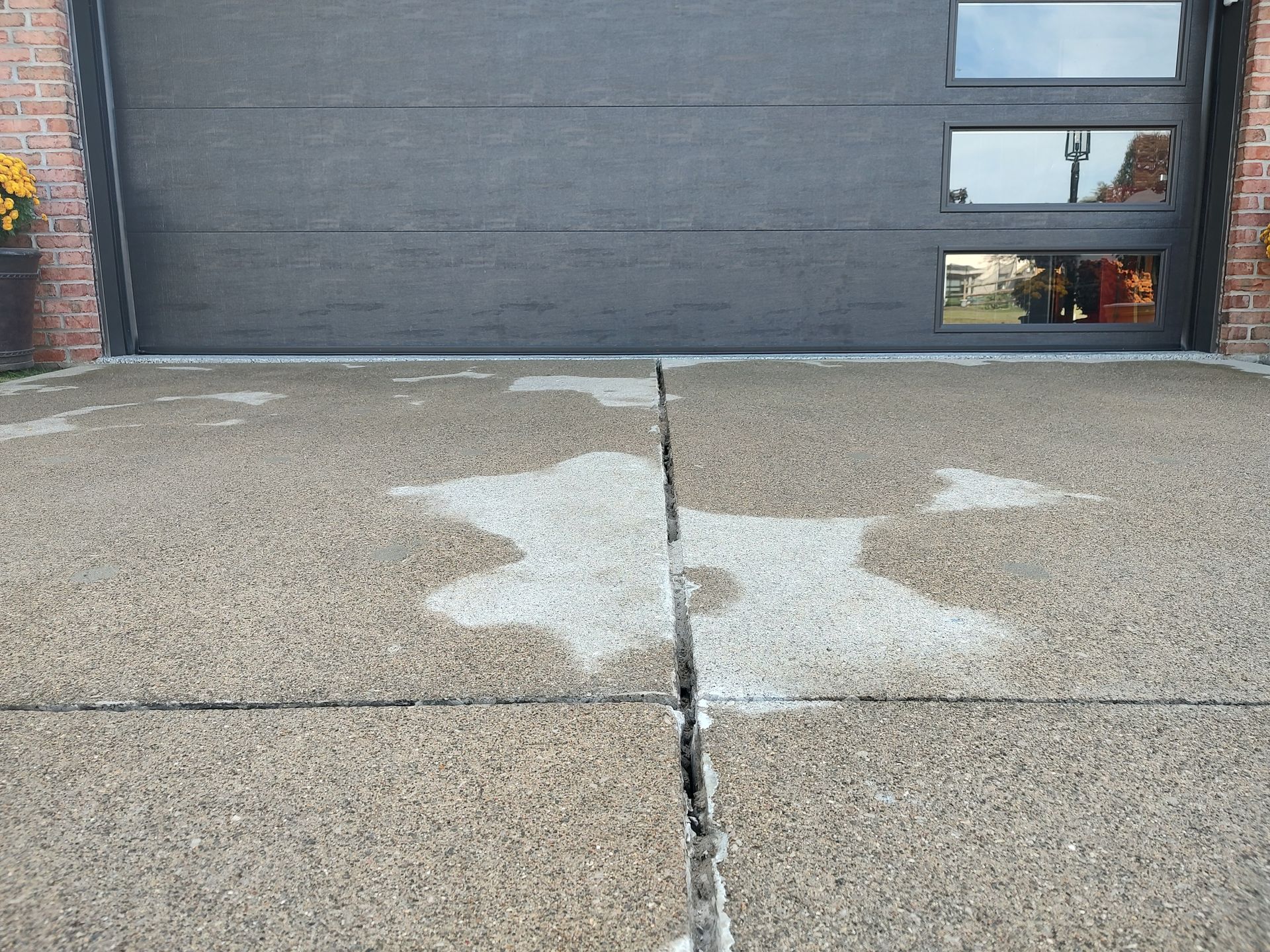 Irwin Concrete Leveling - driveway is flush with the garage floor