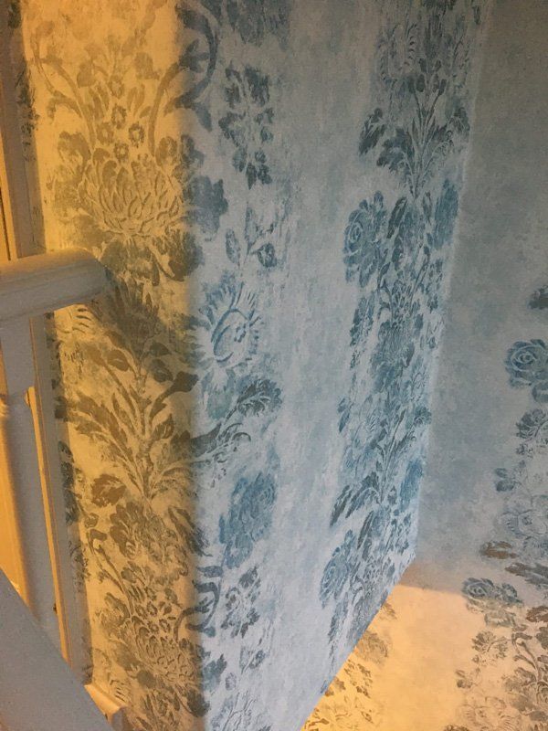 Grey and blue floral wallpaper