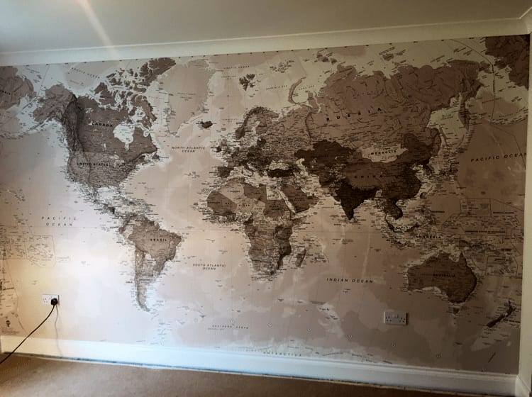 World map printed on a wall