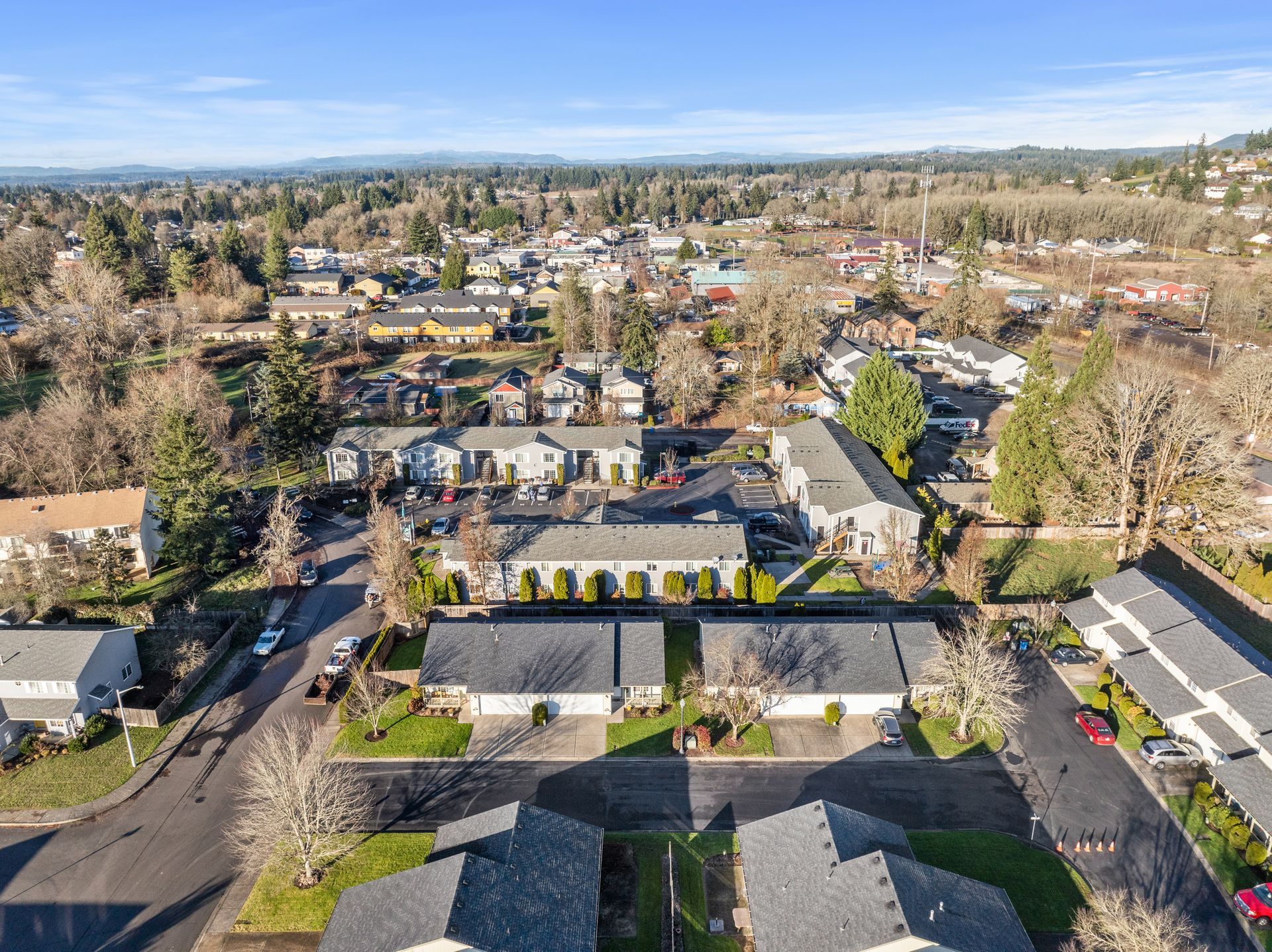 An aerial view of a residential area with lots of houses and trees.