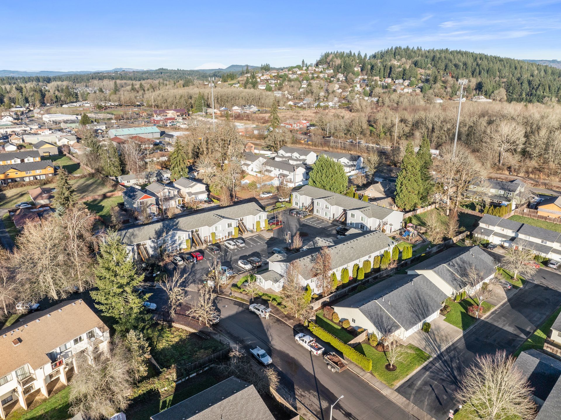 An aerial view of a residential area with lots of houses and trees.