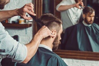 man doing haircut