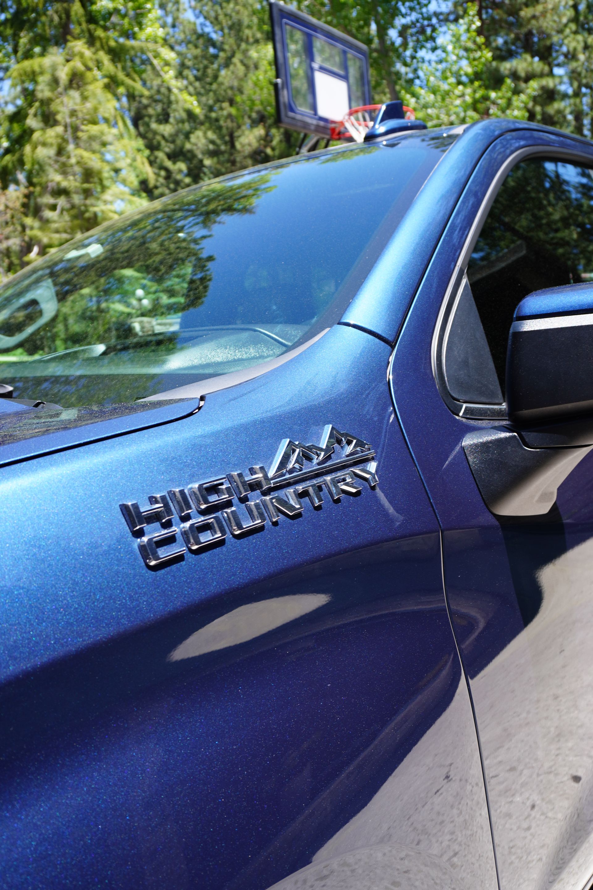 A blue truck with the word country on the side