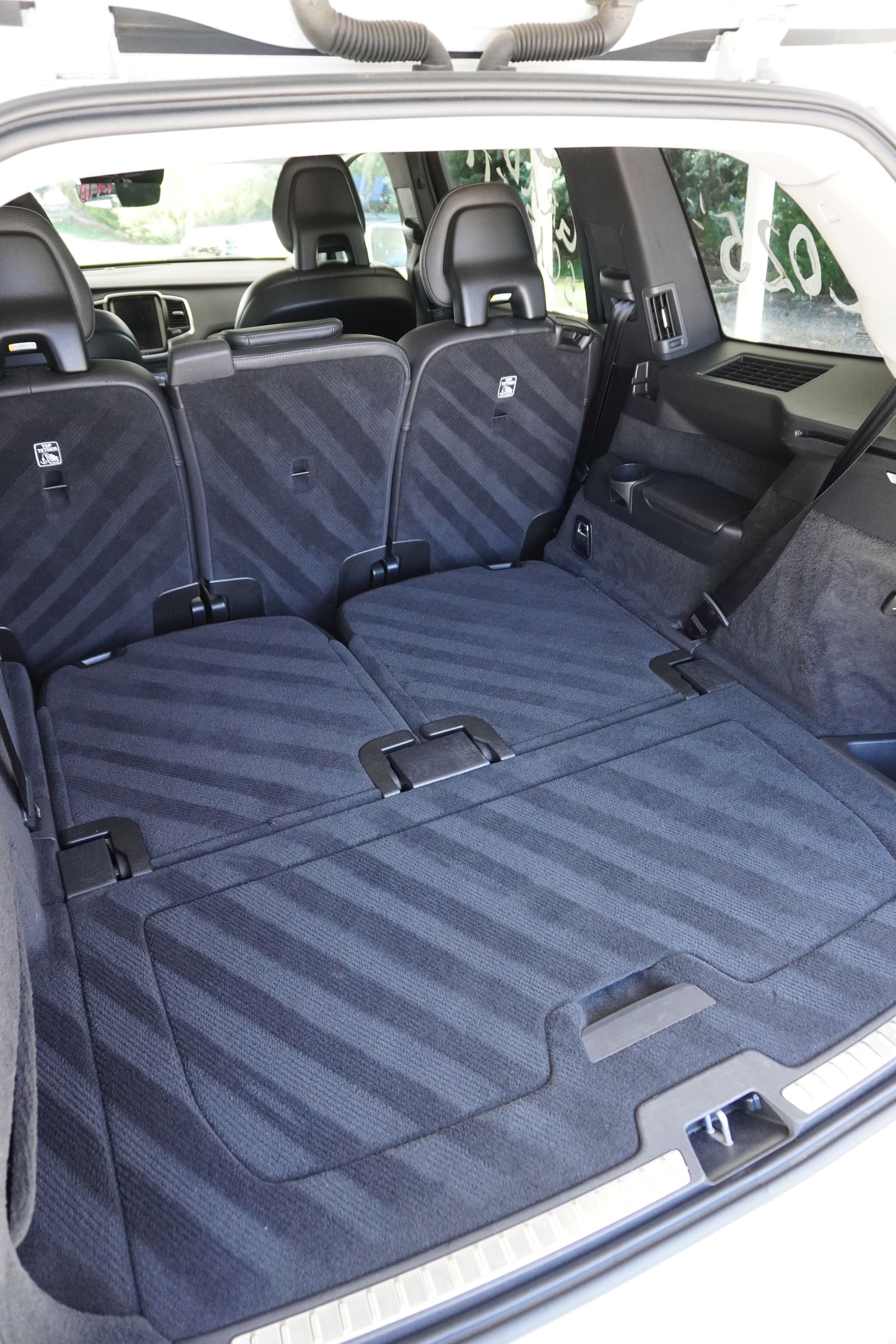 The trunk of a car with the seats folded down.