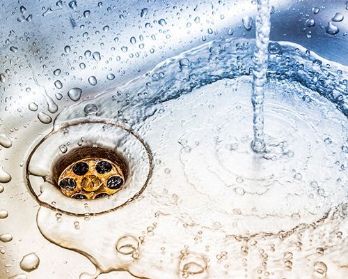 water flowing down the drain