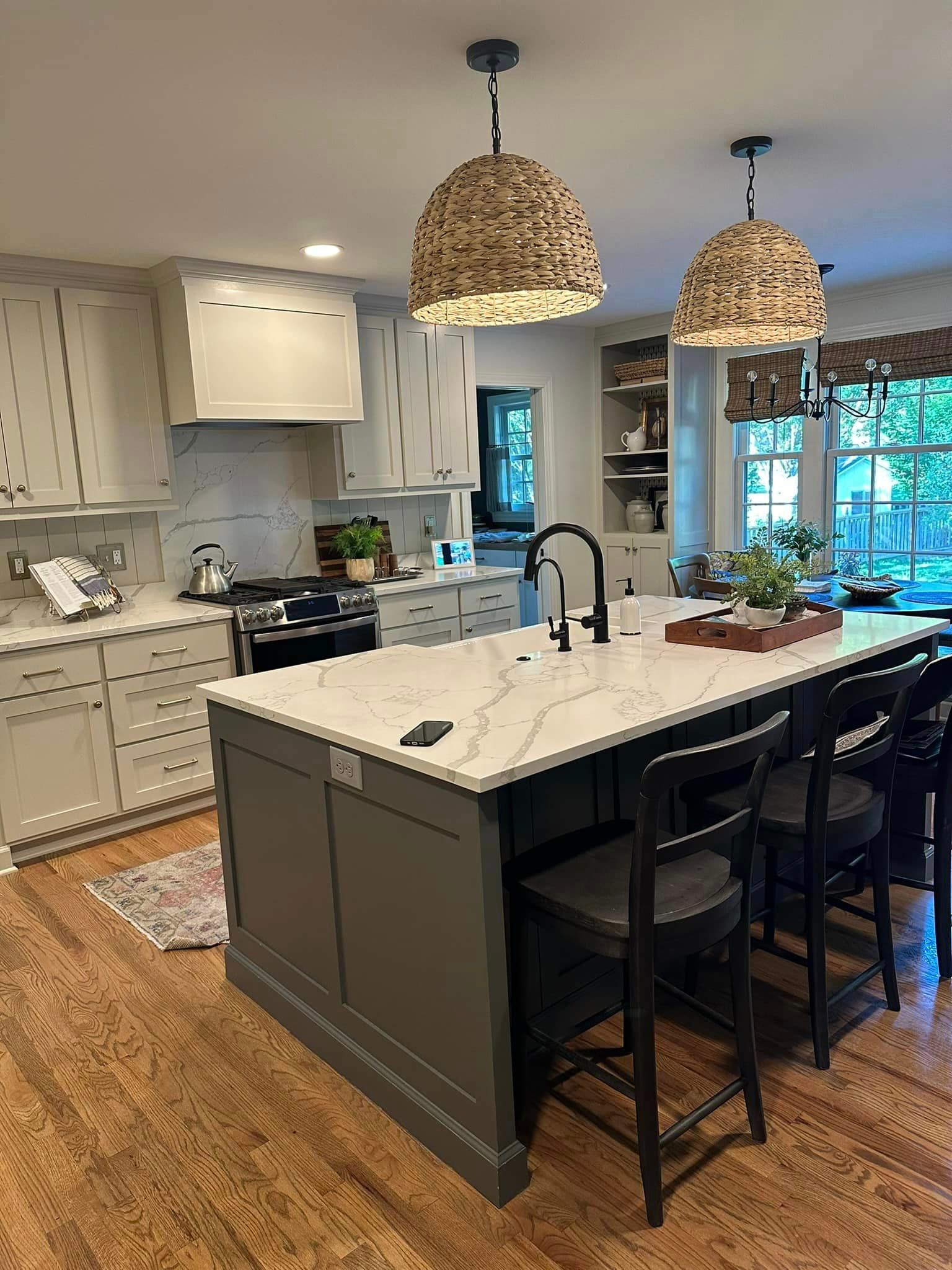 There is a large island in the middle of the kitchen.