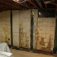 A basement with brick walls and a window