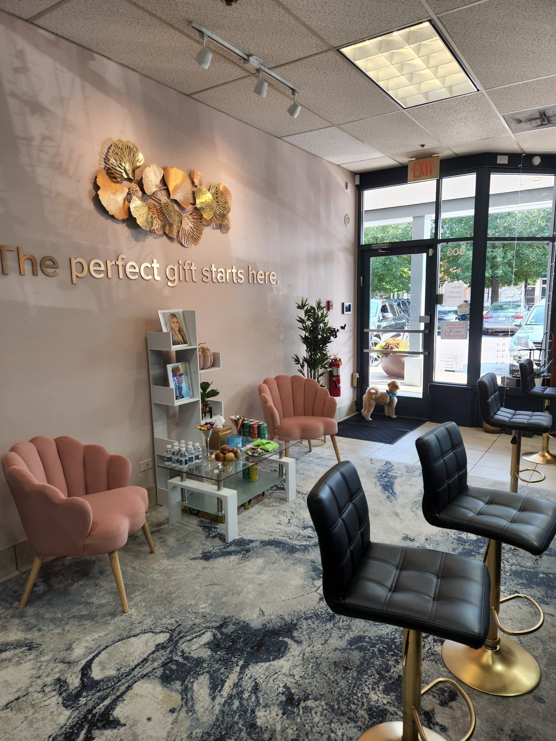 A living room with chairs and a sign that says the perfect place