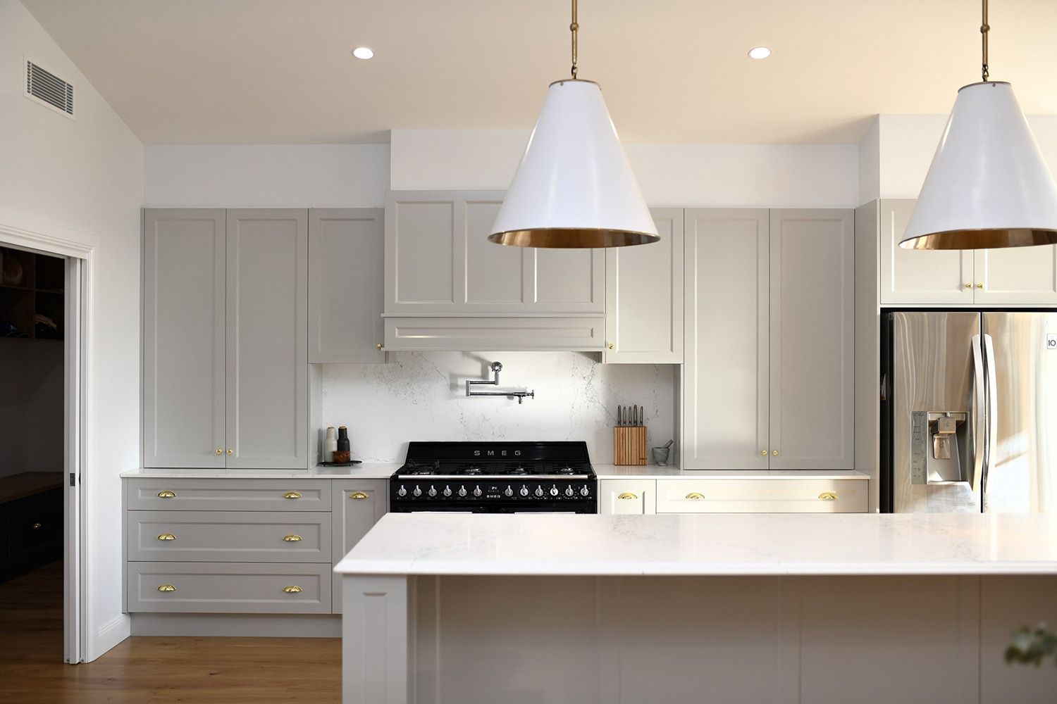 A Kitchen With White Cabinets, a Stove and a Refrigerator — Simmonds Kitchens & Detailed Joinery in Gunnedah, NSW
