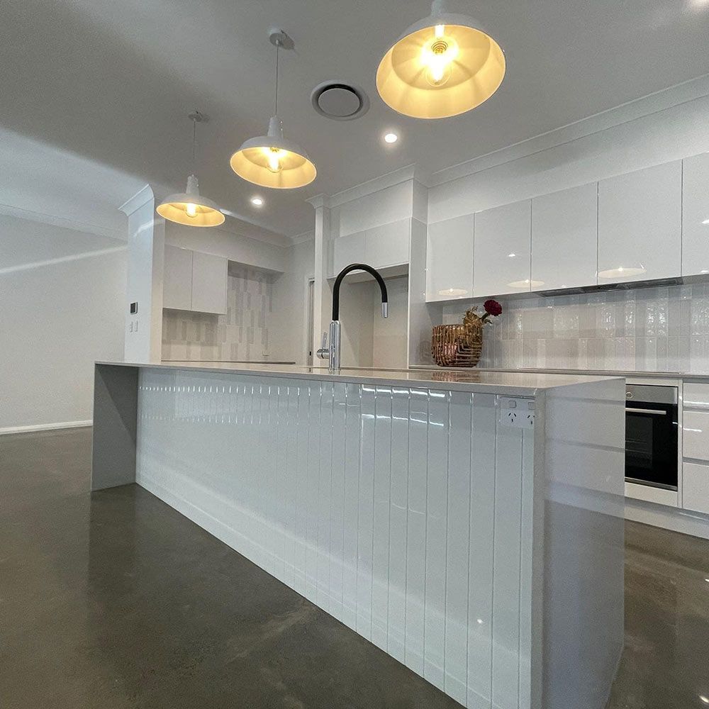 A Kitchen With White Cabinets and a Large Island — Simmonds Kitchens & Detailed Joinery in Gunnedah, NSW