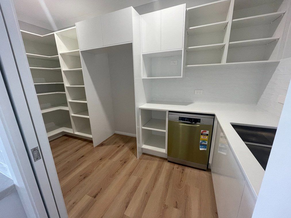 Empty White Cabinet in the Laundry Area — Simmonds Kitchens & Detailed Joinery in Tamworth, NSW