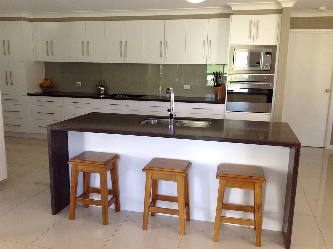 A Kitchen With a Large Island and Three Stools — Simmonds Kitchens & Detailed Joinery in Narrabri, NSW