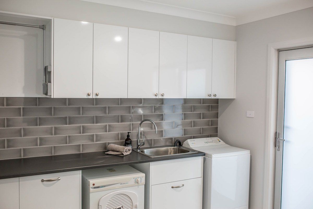 Laundry Area with Custom Built Cabinet — Simmonds Kitchens & Detailed Joinery in Tamworth, NSW