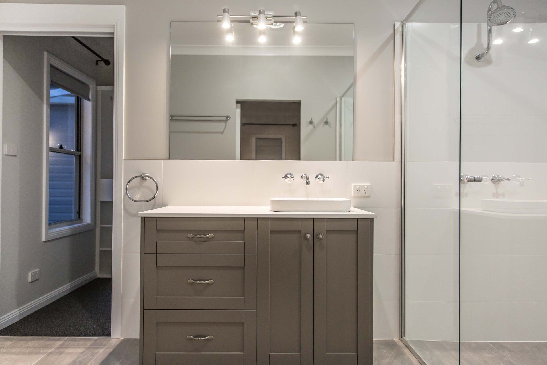 Bathroom with Mirror, Cabinet, Glass Shower Area — Simmonds Kitchens & Detailed Joinery in Tamworth, NSW
