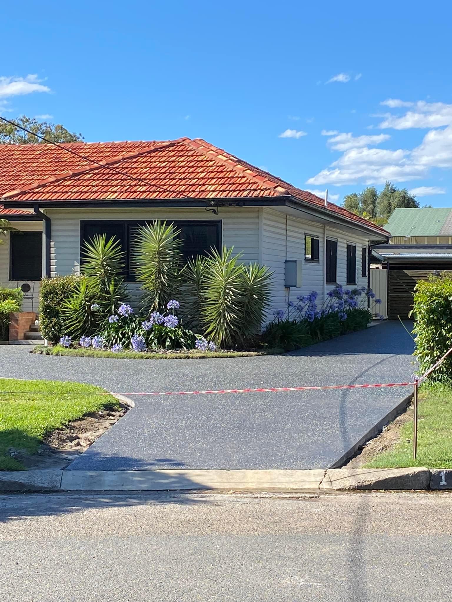 View of a house and concrete driveway — Williams Concreting In Taree, NSW