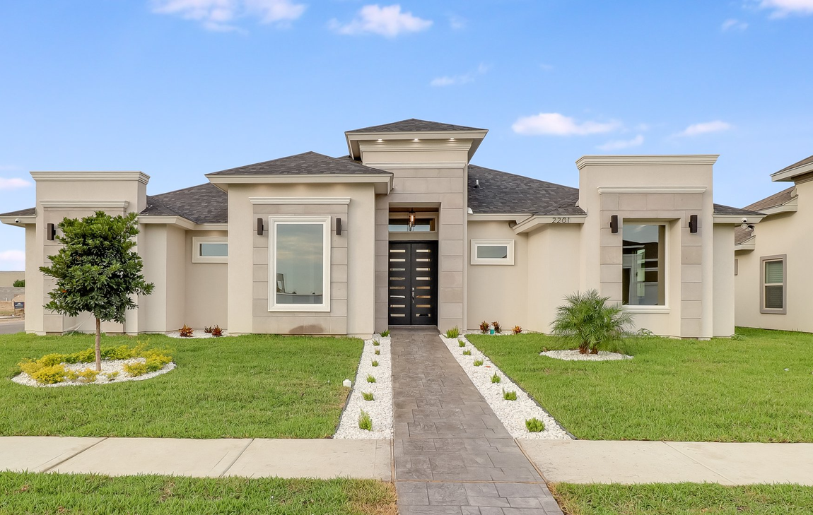 beautiful exterior of elegant and spacious house, front yard with decorated driveway