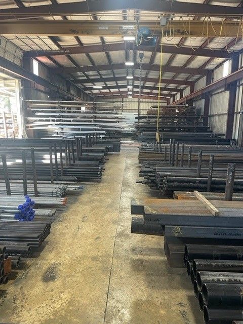 A large warehouse filled with lots of metal pieces.