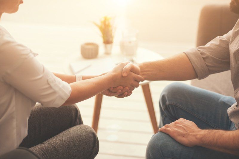 two people greeting each other