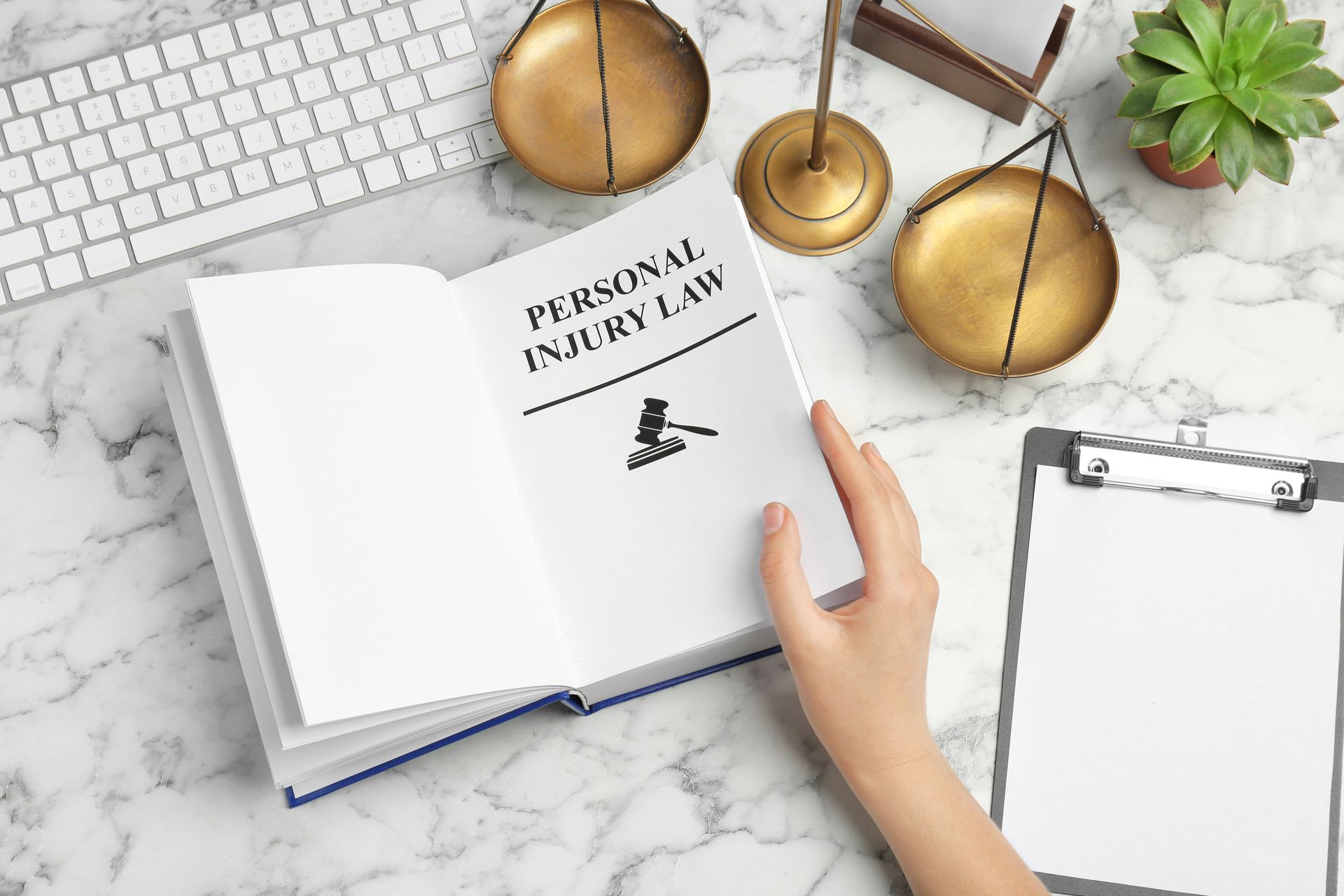 A personal injury lawyer reviewing a law book.