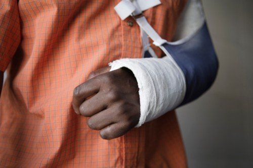 A man with a broken arm speaking to his personal injury attorney in Lexington, SC