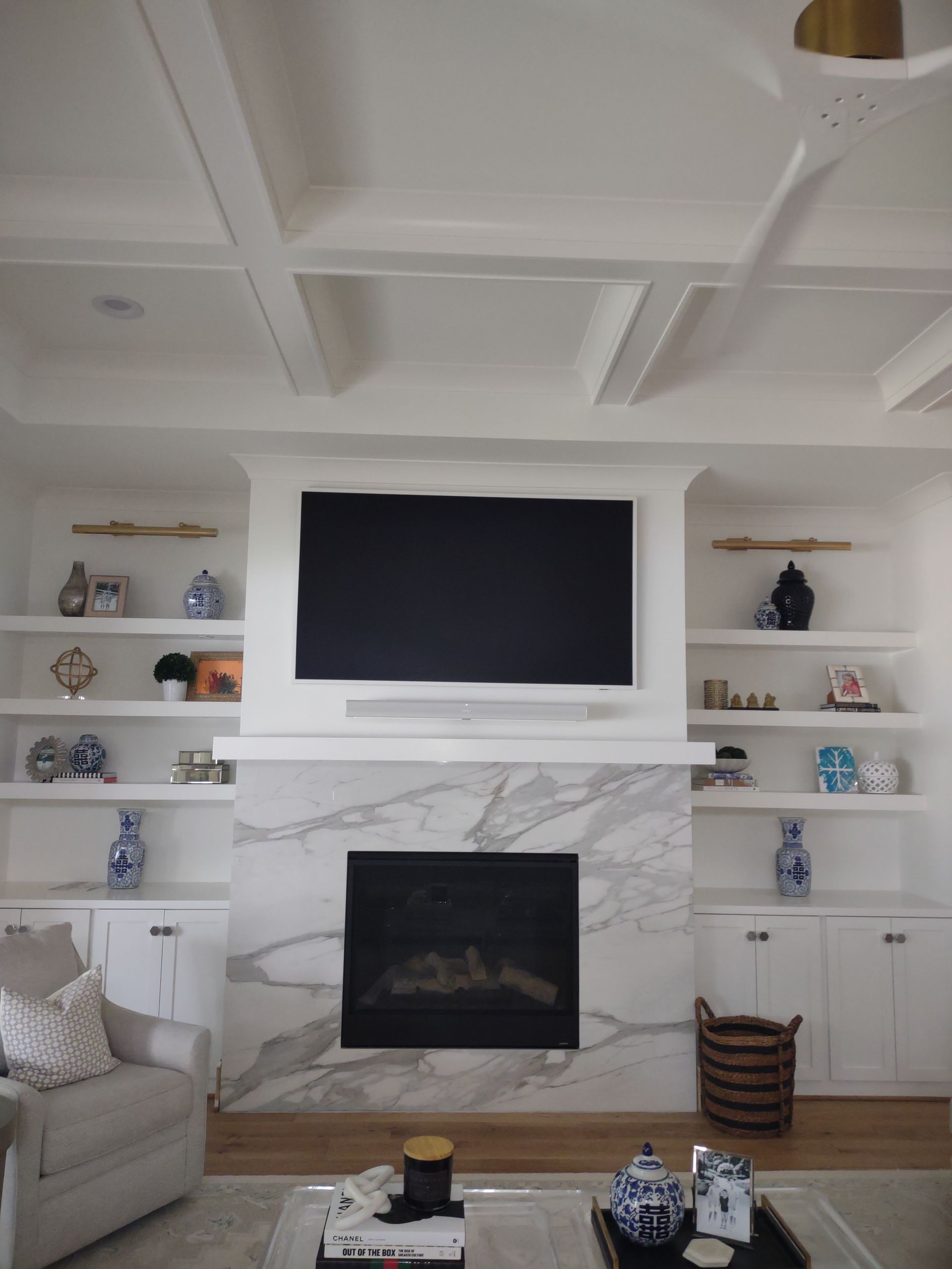 Frame TV above fireplace with sound bar