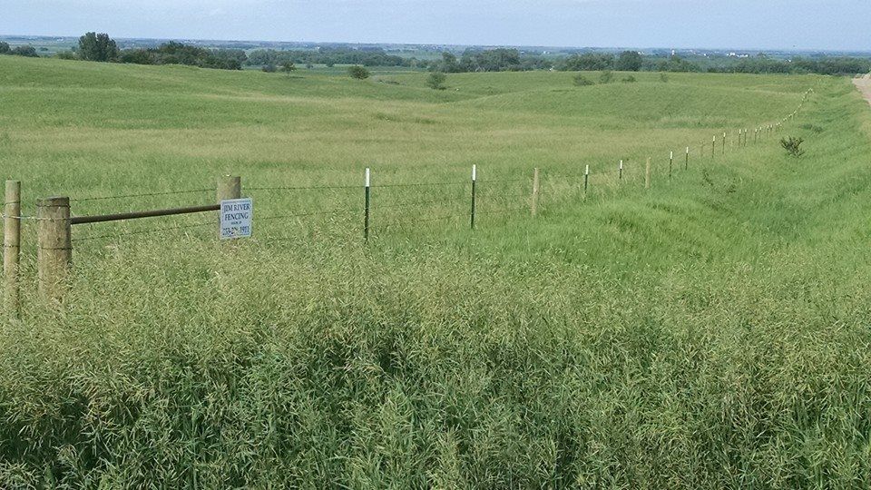 Wooden fence in a grassy field — fencing in Volin, SD