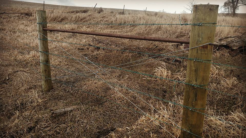 Old wooden fence with barbed wire — fencing in Volin, SD