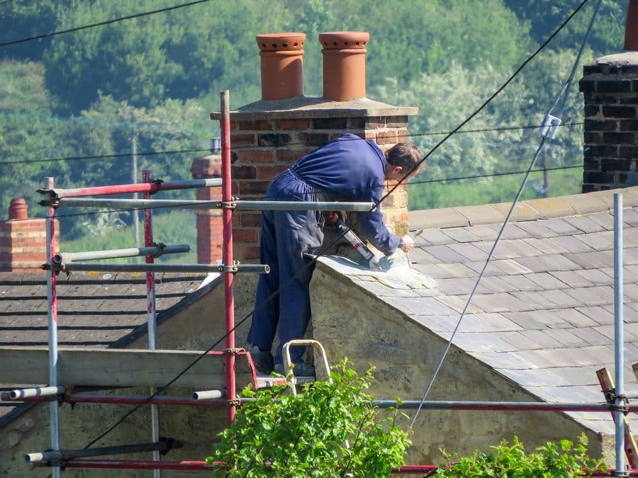 Roofer Repairing Flashing On Chimney — Metal Roofing in Tweed Heads South, NSW