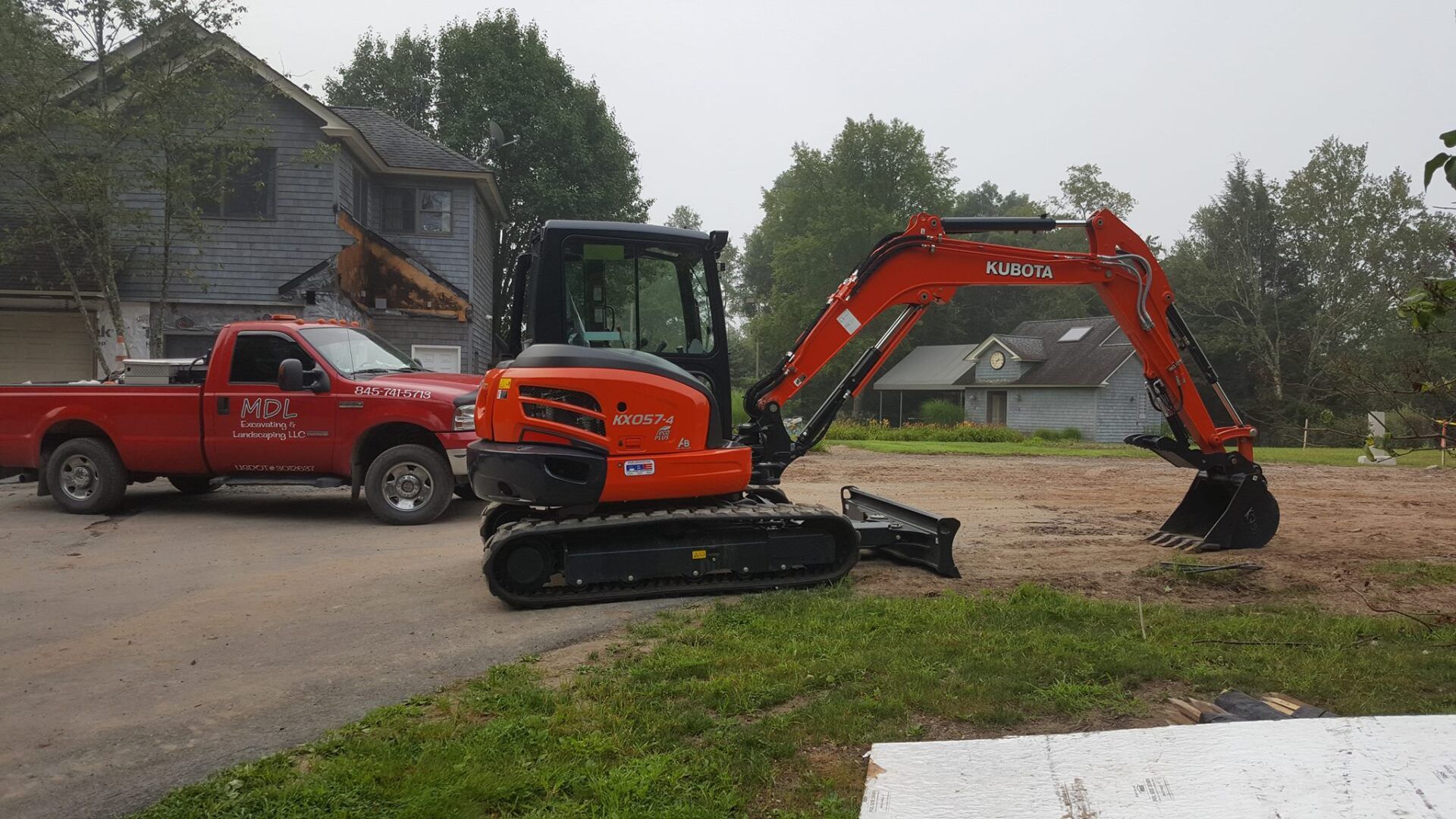 Excavator & Grass — Wurtsboro, New York — MDL Excavating Landscaping LLC