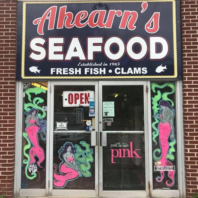 Ahearn's Seafood storefront with mermaid art,