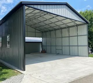 A large metal building with a roof that is open.