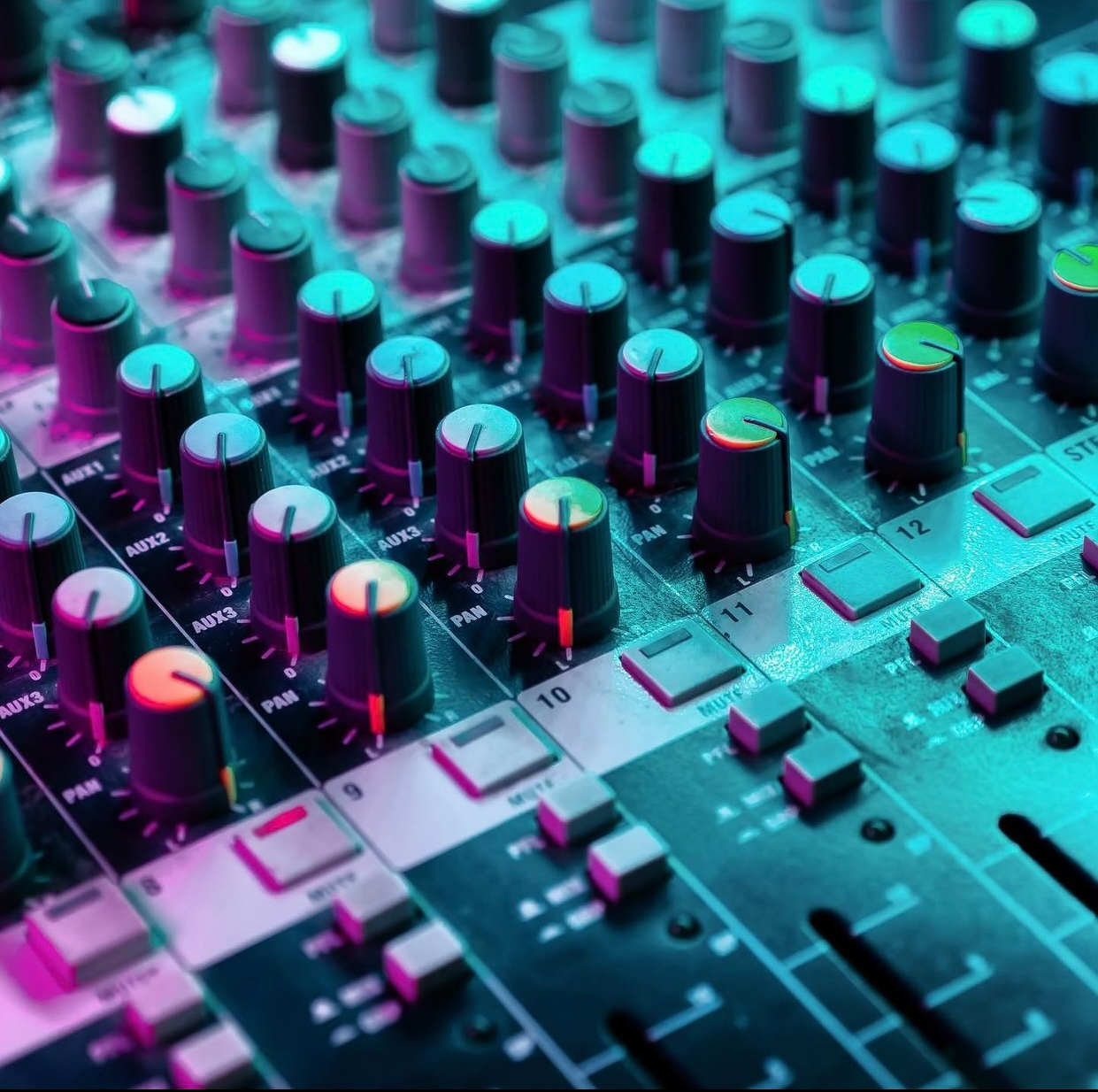 A mixer with a bunch of knobs and buttons on it.