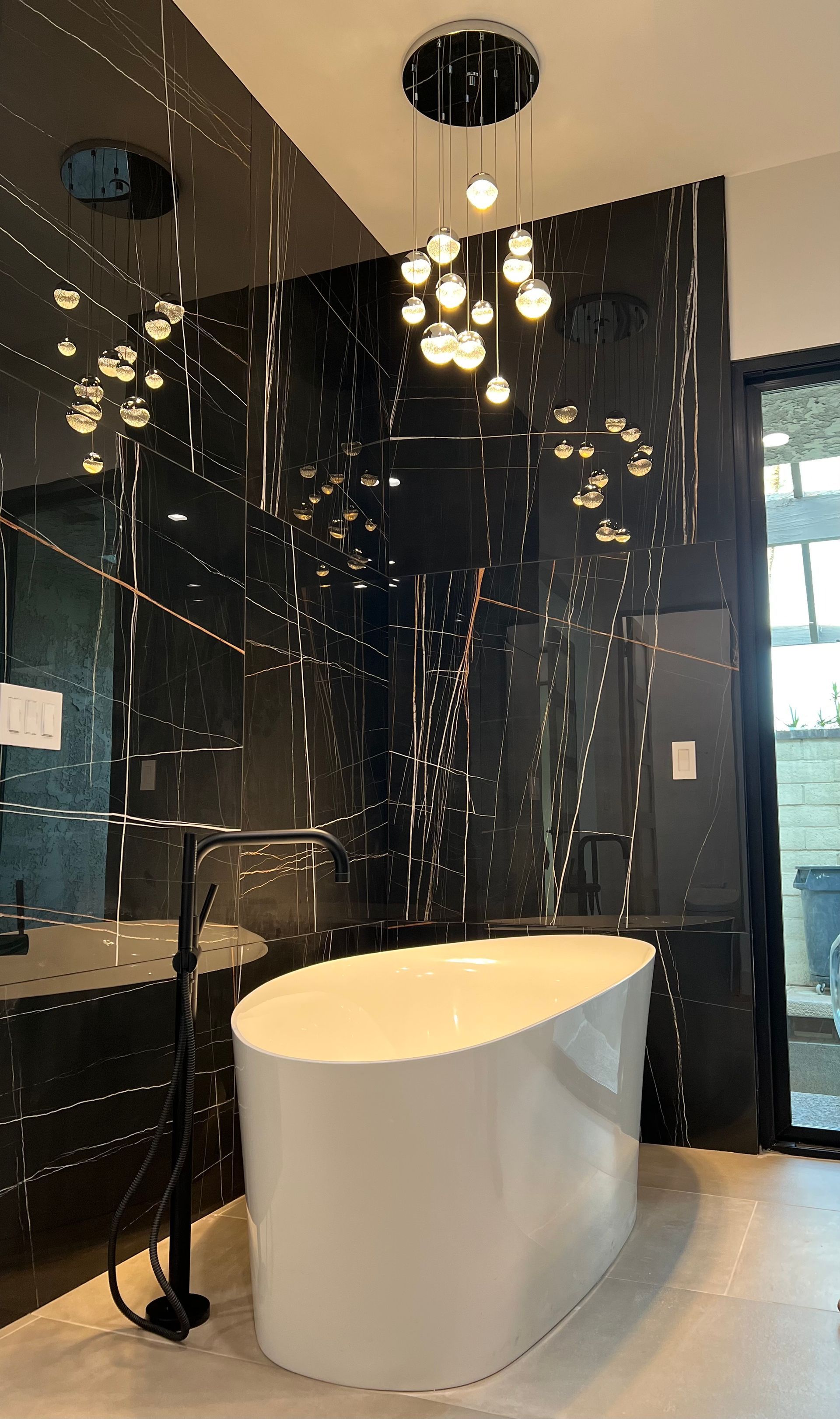 A bathroom with a bathtub and a shower.