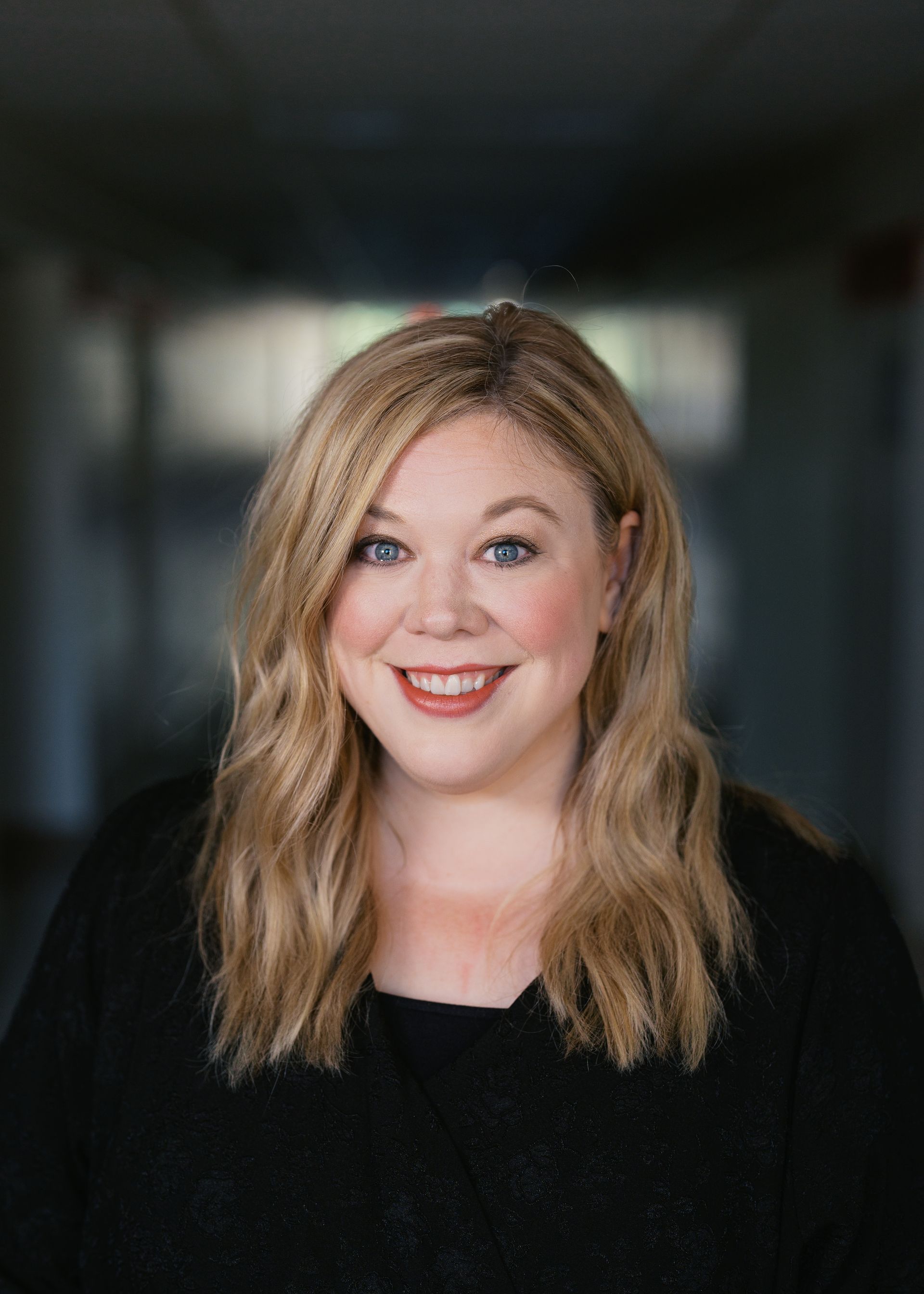 A silhouette of a person without a face on a white background.